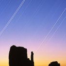 Crescent Moon and Star Tracks with Sunrise Glow, Monument Valley